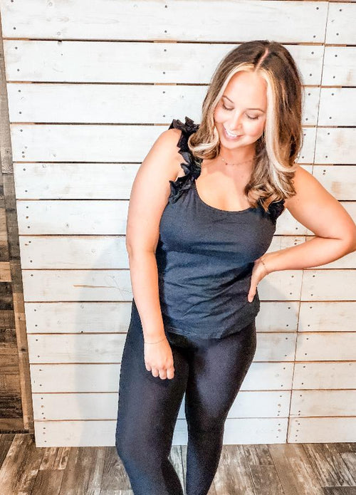 Black ruffle sleeve tank top styled with leggings