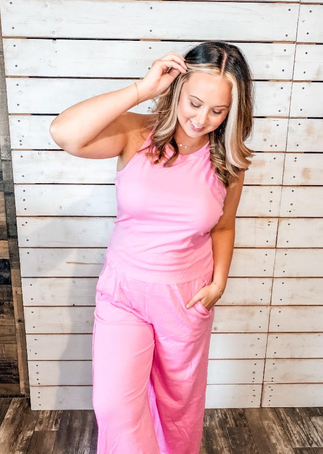 Pink lounge set showing wide-leg pants with pockets
